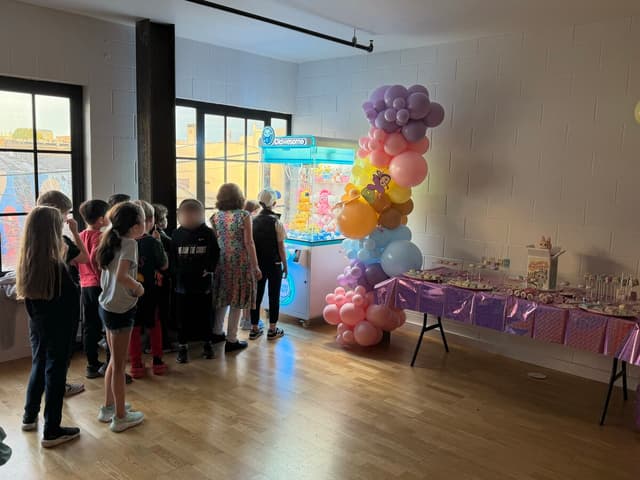 Kids birthday party with Clawesome claw machine rental