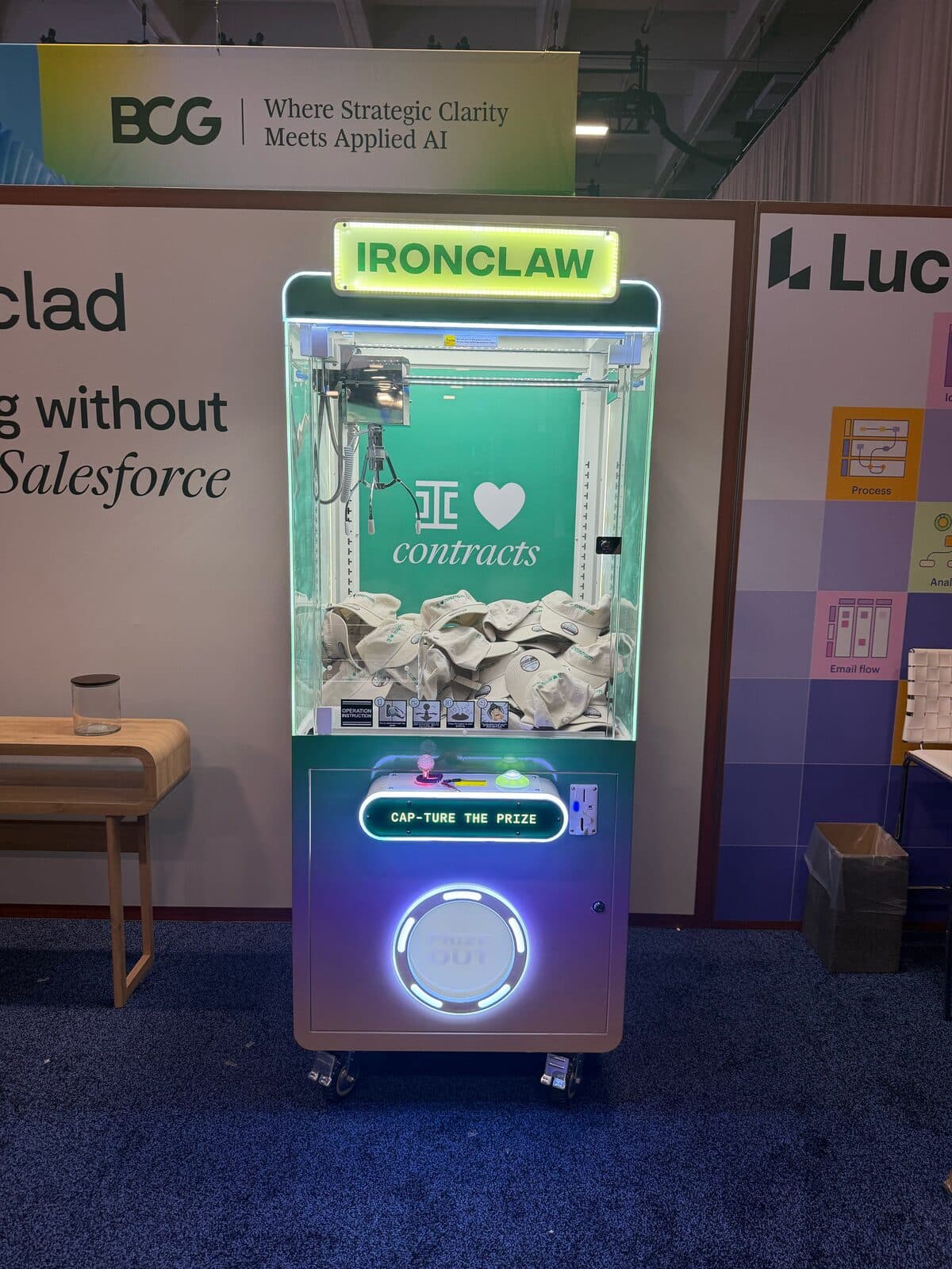 Ironclad branded claw machine with IRONCLAW marquee at a Dreamforce booth